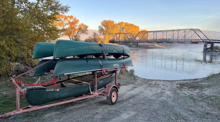 Canoes on a trailer by the Jefferson River.